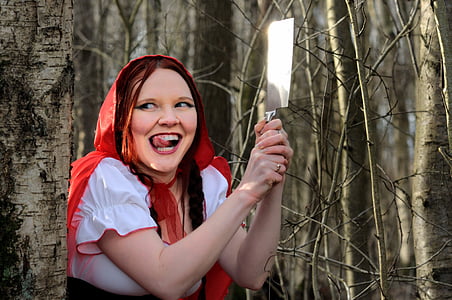 red riding hood on brown trees thumbnail