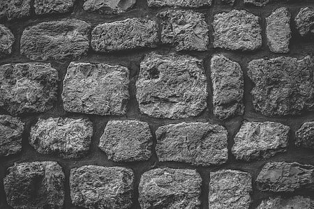 Black and white image of a textured stone wall thumbnail