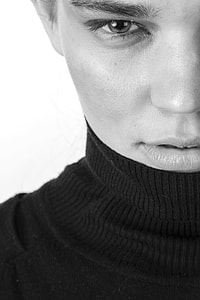 man wearing black turtle-neck top thumbnail