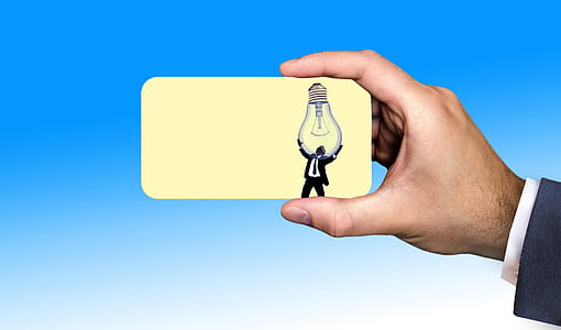 person holding business card thumbnail