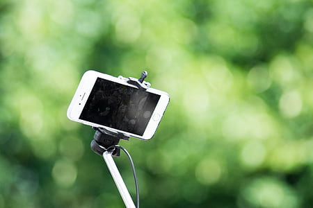 silver iPhone 6 in selfie stick thumbnail
