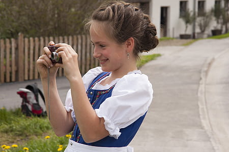 woman using black camera thumbnail