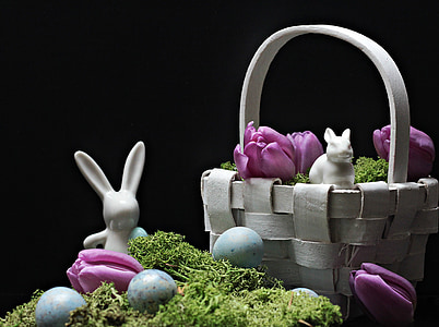 white rabbit ceramic figurine beside woven basket thumbnail