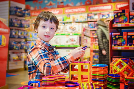 boy holding plastic toy thumbnail