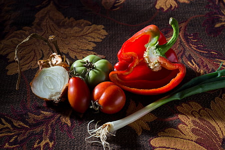 slice red bell pepper, onions and red tomato fruit on brown floral textile thumbnail