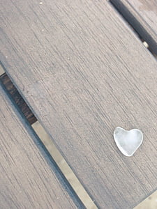 white crystal on top of brown table thumbnail