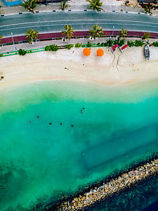 aerial view of beach near street thumbnail
