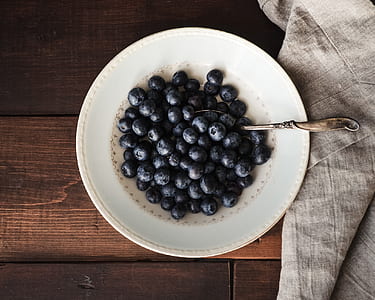 blue berries on round white ceramic plate thumbnail