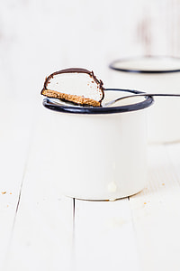 white and brown cookie on gray metal spoon thumbnail
