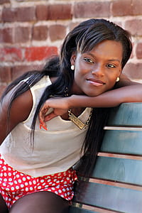 Woman in White Tank Top on Blue Bench thumbnail