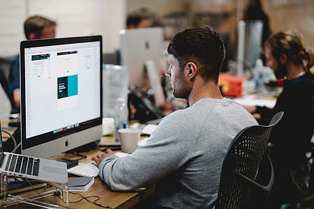 man in front of iMac Aluminum thumbnail