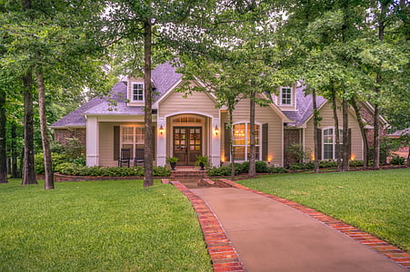 white and gray wooden house with brown pathway thumbnail
