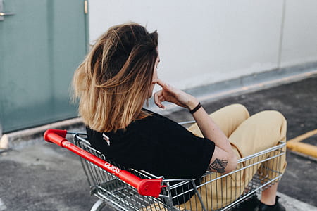 woman riding shopping cart thumbnail