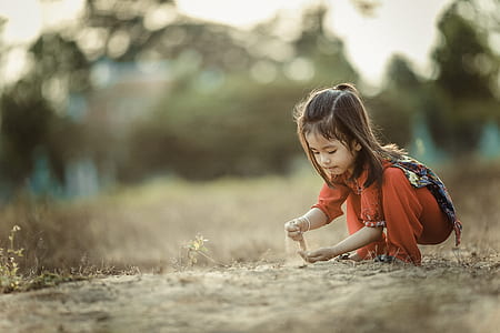 girl holding sand thumbnail