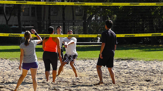 people playing volleyball at field thumbnail