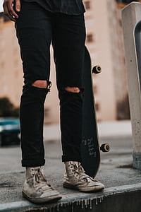 person standing on gray concrete road thumbnail