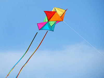 flying yellow, blue, and pink kite thumbnail