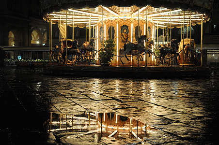 horse carousel with turned on lights during daytime thumbnail