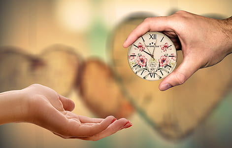 person holding clock thumbnail