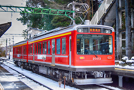 red 2003 train at the train station during day thumbnail