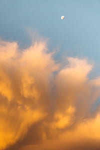 low angle photography of clouds and moon thumbnail