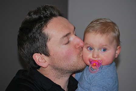 man kissing baby thumbnail