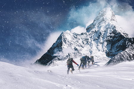 group of people climbing on snow mountain thumbnail