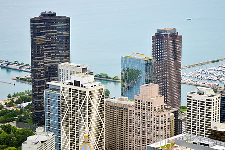 aerial photo of high-rise buildings beside large body of water thumbnail
