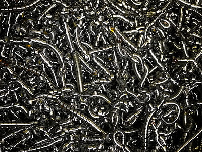 closeup photography of silver metal scrolls thumbnail