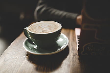 cafe latte served on green ceramic cup thumbnail