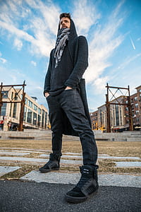 man standing on dried grass thumbnail