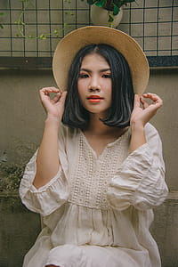 Woman Wearing White Long-sleeved Dress thumbnail