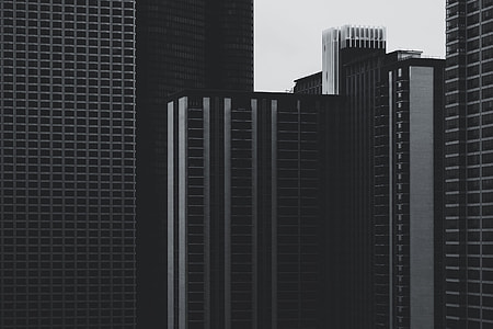 grayscale and architectural photography of high rise buildings thumbnail