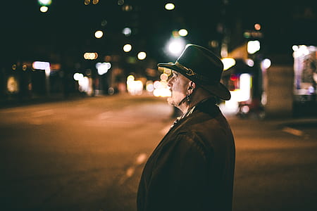 man staring out of nowhere wearing black hat thumbnail