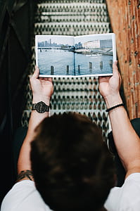 person holding poster thumbnail