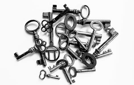 grayscale photo of pile of skeleton keys thumbnail