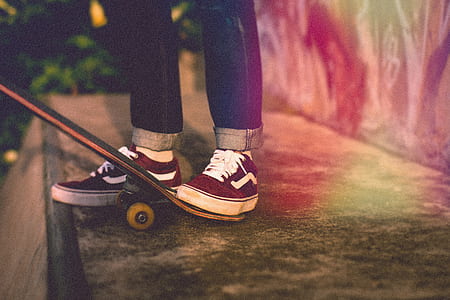 person stepped on black skateboard thumbnail