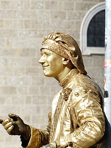man performing near building during daytime thumbnail