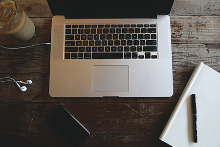 MacBook Pro on brown table thumbnail