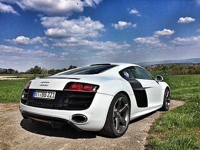 white coupe parked thumbnail