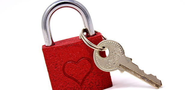 red and gray padlock and key on white surface thumbnail