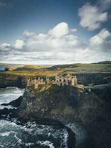 aerial photography of castle on cliff thumbnail
