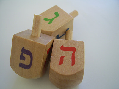 three beige, red, and green wooden blocks on beige panel thumbnail