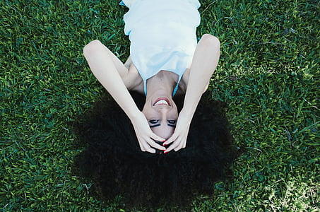 photograph of woman spreading hair on grass thumbnail