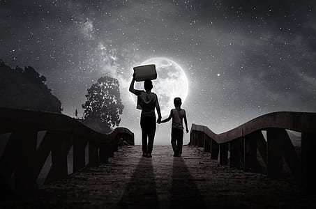 person holding the hand of the child while carrying box digital wallpaper thumbnail