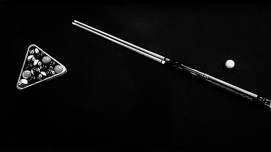 grayscale photo of billiard balls inside billiard rack, cue stick and ball thumbnail