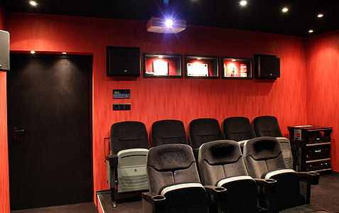 black gang chairs near closed black wooden door inside room thumbnail
