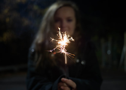 woman holding fireworks stick thumbnail