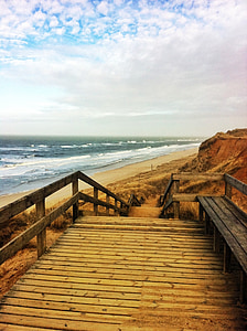 cloudy sky over beach shore thumbnail