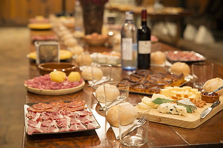 assorted cooked dishes on table with cup and knifes thumbnail
